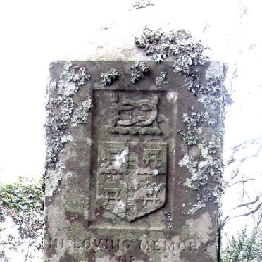 2. Crest at the top of the main headstone