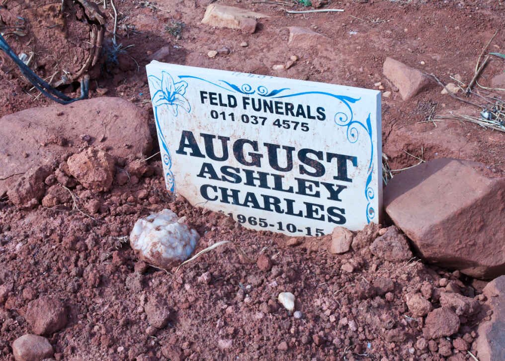 AUGUST Ashley Charles 1965-