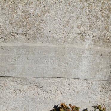 ? Tombstone nearly illegible